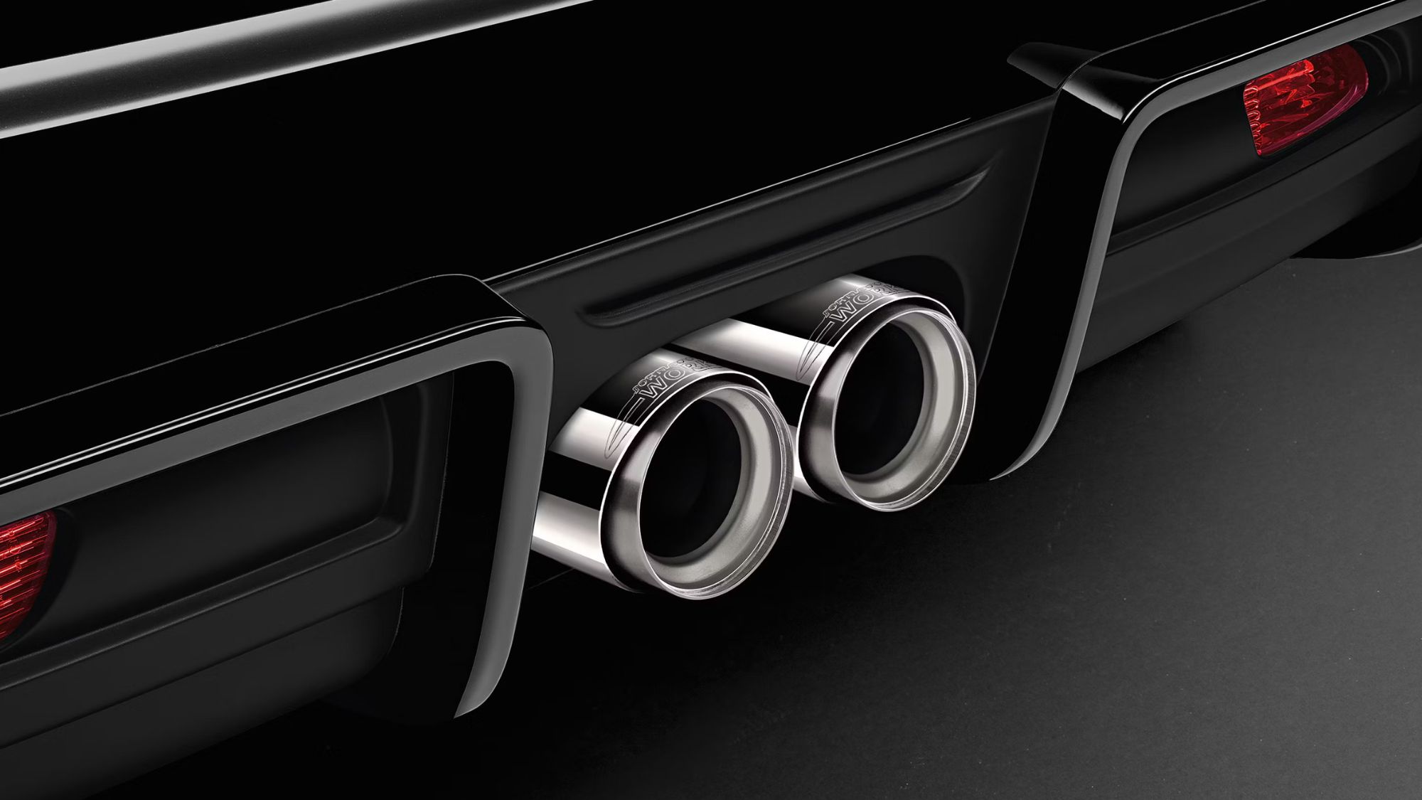 A black car with automobile exhaust system sound deadner tip