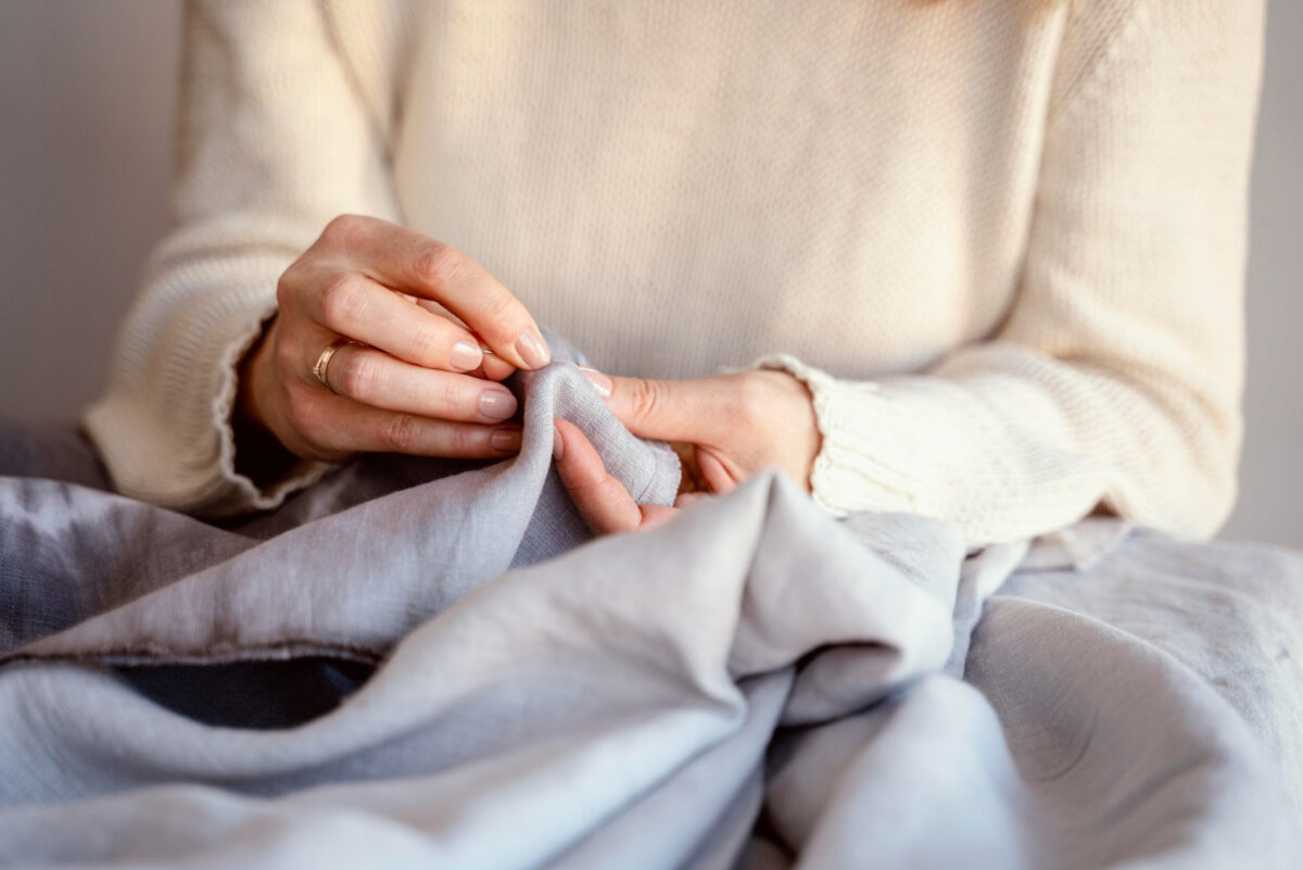 woman checking linen fabric