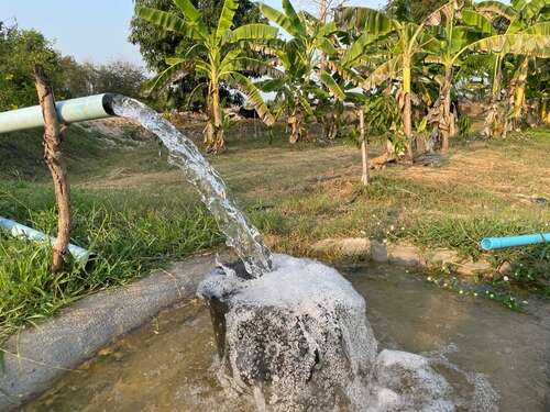 Agriculture,Blue,Pipe,With,Groundwater,Gushing,In,Pond-mixed,Agricultural,Garden