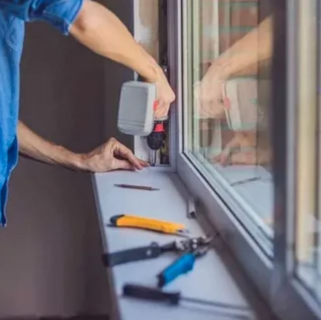 A man carefully installs a sliding glass door, ensuring proper alignment and secure fittings for optimal functionality.