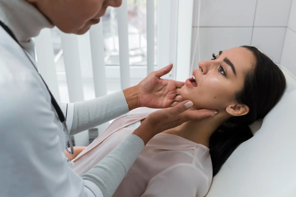 doctor checking patient-s mouth