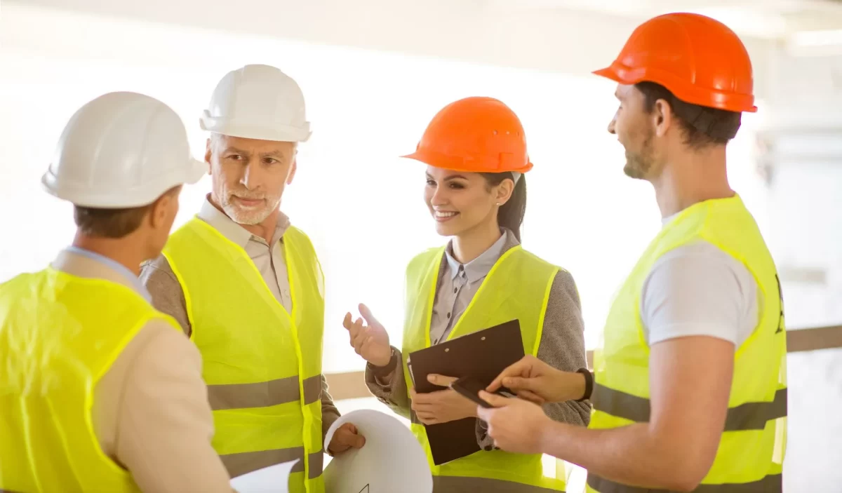 Construction workers discussing about the work