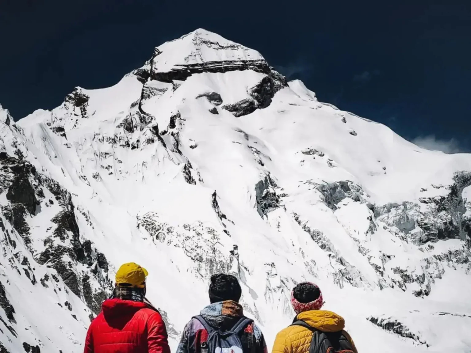 Adi Kailash peak covered in snow with a clear blue sky.