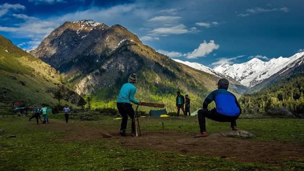 Trekking group enjoying the view at Har Ki Dun summit