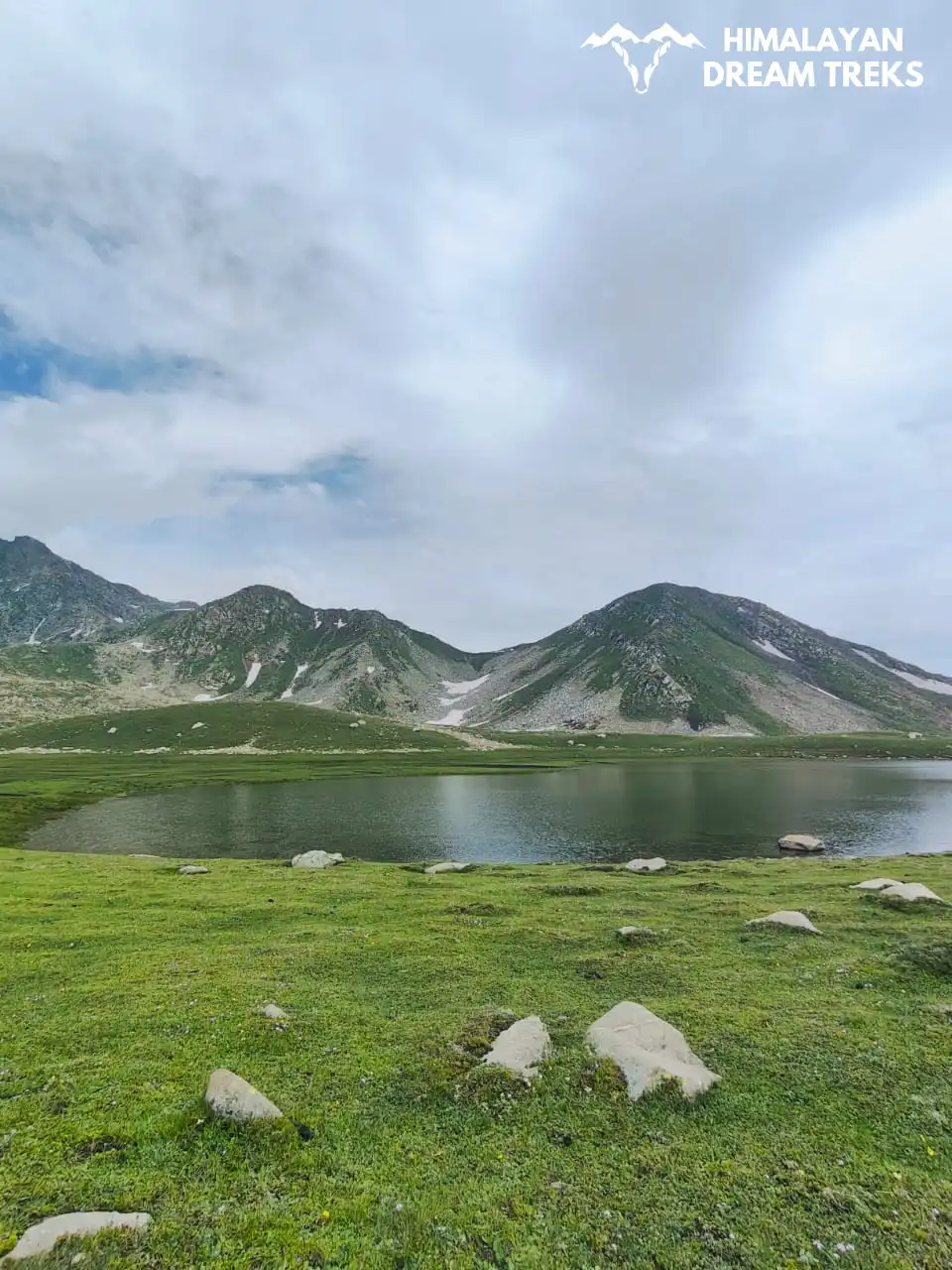 Trekking through the famous lake surrounded by lush green meadows of the Pir Panjal Range